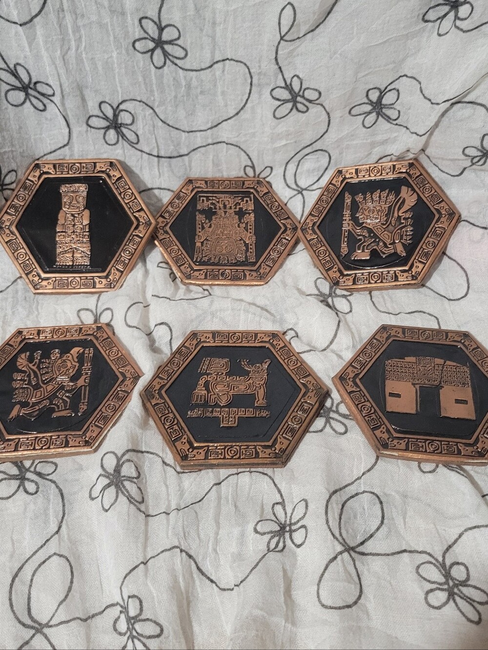 Vintage set of 6 Peruvian Incan embossed copper coasters